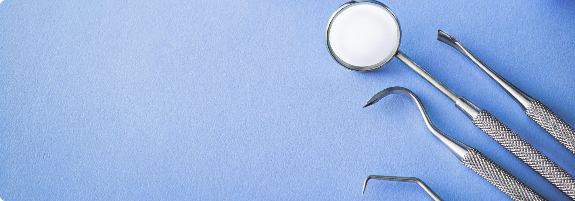 dental tools on a blue background