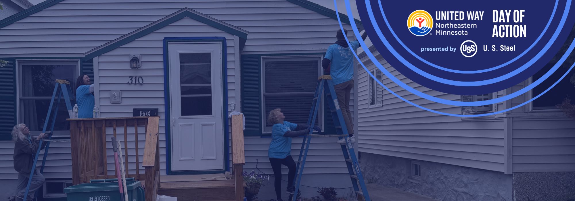 volunteers paint a house for Day of Action 
