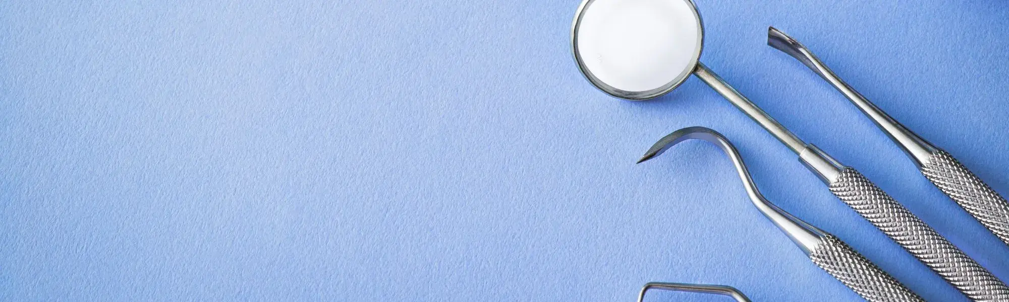 dental tools on a blue background