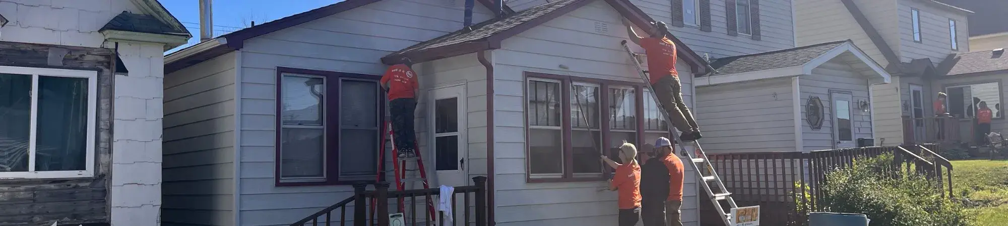 Volunteers work on Keewatin residents houses for UWNEMN's 2024 Day of Action.