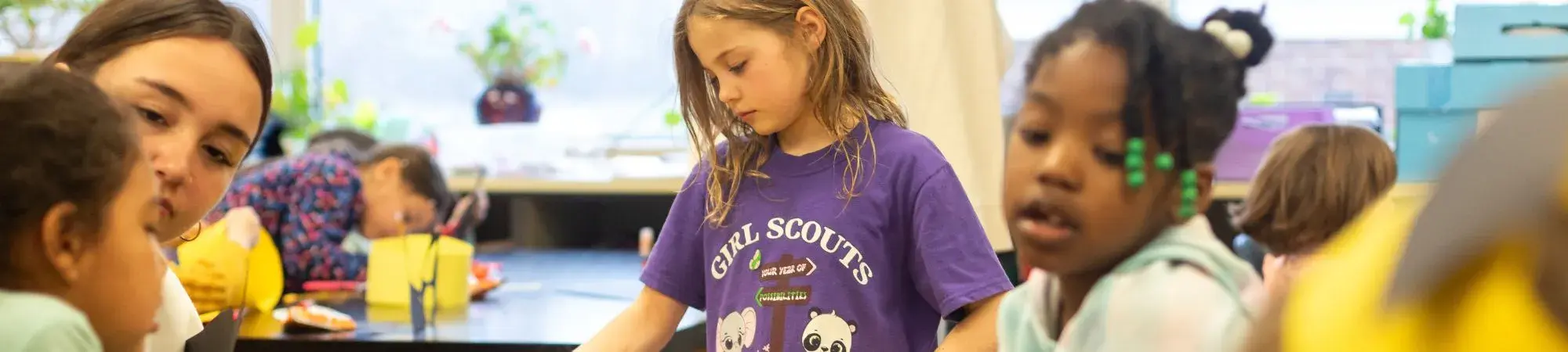 Girl scouts work on projects together